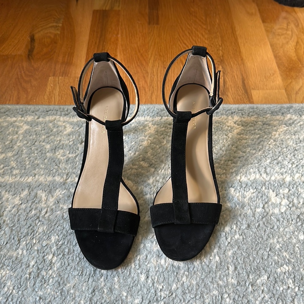 Black leather heels with front strap